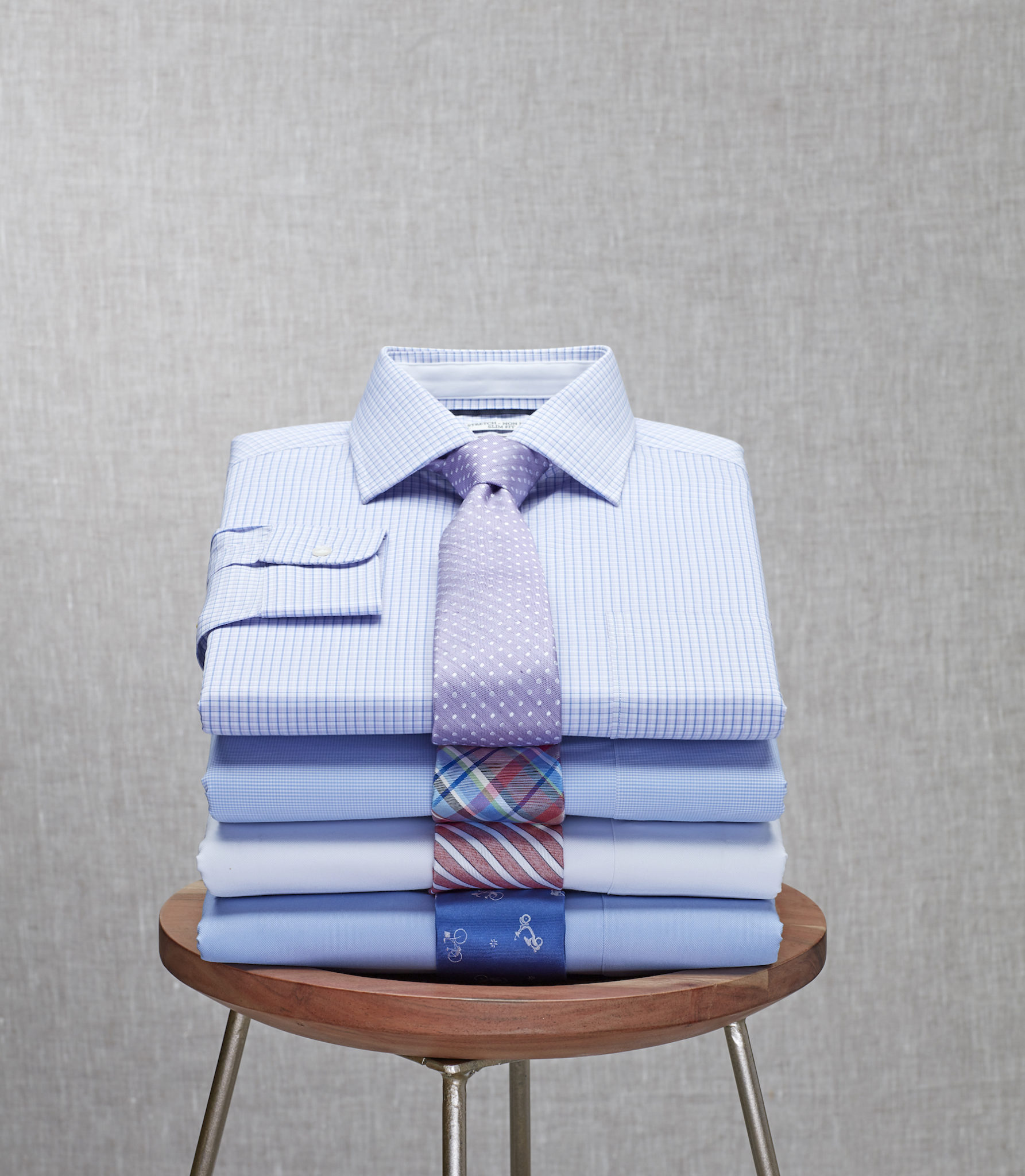 Jos A Bank_colorful stack of shirts_light gray background - brrrº
